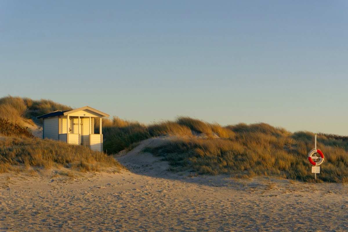 a lifeguard station on a sandy beach